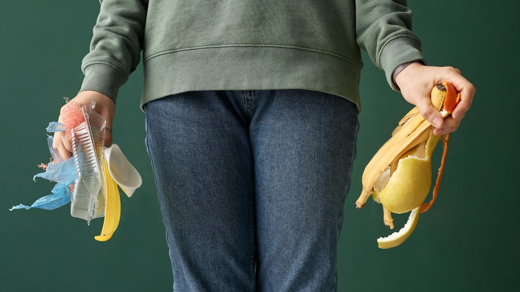 A girl holding some waste going for waste management